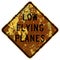 Old rusty American road sign - Low flying planes