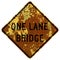Old rusty American road sign - One lane bridge