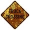 Old rusty American road sign - Truck crossing