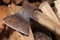 An old rusty axe on the woodshed in the barn