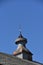 Old rusty barn cupola with a lightning rod