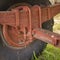 Old rusty big wheel of a tractor trailer cart