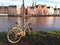 Old rusty bike was pulled out of the water. It lay in water for a long time and is covered with mud and shells.