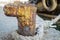 Old Rusty Bollard with Frayed Ship Rope at the Harbor. Nautical