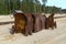 Old rusty buckets of giant mining excavators