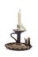 Old rusty candlestick with blasted candle