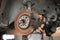 Old and rusty car`s suspension parts. Rusted disc brake and caliper on the car. Automotive industry and garage concepts.