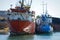 Old, rusty, cargo vessels at a ship-breaker.