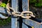 Old rusty chain on the fence