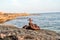 Old rusty chains and bitts of sea in the background