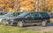 Old rusty cheap car Renault Laguna hatchback first model parked