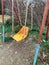 Old rusty children`s swings for skating and games