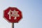 Old rusty chinese stop sign