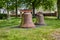 Old, rusty church bell on a meadow in the rural municipality of Rangsdorf in Germany