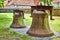 Old, rusty church bell on a meadow in the rural municipality of Rangsdorf in Germany