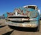 Old rusty classical vintage American car left in dessert