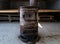 Old rusty coal stove for railway car heating