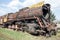 Old rusty crumbling locomotive in the abandoned station