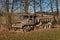 Old rusty Czech military truck. Abandoned rusty car. Lorry and overgrown grass.