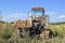 Old rusty disassembled combine harvester.