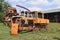 Old rusty disassembled tractor. Soviet agricultural machinery.