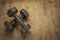 old rusty dumbbells on textured handmade bark paper