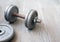 Old rusty dumbbells without use on a gray background