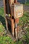 Old rusty electricity pole outdoors