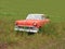 Old rusty Ford in a field