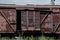 Old rusty freight car stands on rails in Ukraine