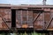 Old rusty freight car stands on rails in Ukraine