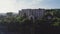 Old rusty and functioning ropeway or cable car cabins in Chiatura. Panorama of the city district and apartment buildings on the ro