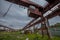 Old rusty gantry bridge crane in abandoned factory