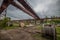 Old rusty gantry bridge crane in abandoned factory