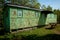 Old and rusty green iron trailer