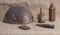 Old rusty grenades, cartridges and a helmet of the second world war on the fabric. Closeup