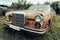 Old rusty grunge retro vintage car with peeling paint close up, abandoned auto