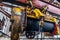 Old rusty hoist of Industrial overhead crane in factory. Close up