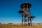 Old rusty iron abandoned watch tower in wastelands