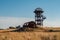 Old rusty iron abandoned watch tower in wastelands