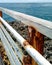 An old rusty iron fence at the beach