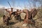 Old rusty iron plow abandoned.