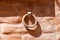 Old rusty iron ring close up image with a solid iron ring to secure on the old stone and brick surface.