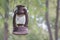 Old and rusty kerosene lantern have bokeh as background