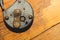 Old rusty lock on a wooden table. Vintage padlock on the wood background