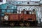 Old rusty locomotive. Abandoned railway. Abandoned factory