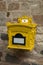 Old rusty mailbox on the timbered wall