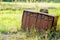 Old rusty mailboxes in rural area on a green background