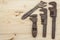 Old rusty mechanics tools on a wooden background. Advertising for new tools. Sales tools