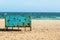 Old rusty metal cabana on empty sandy beach